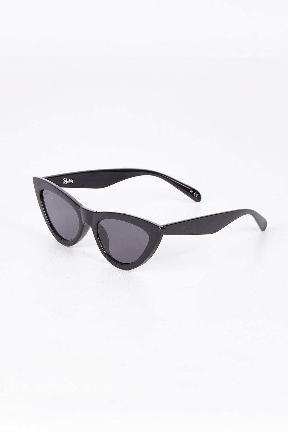 A model wearing the Kiss Kiss Sunglasses in colour Black (Black), from the front, showing the whole outfit