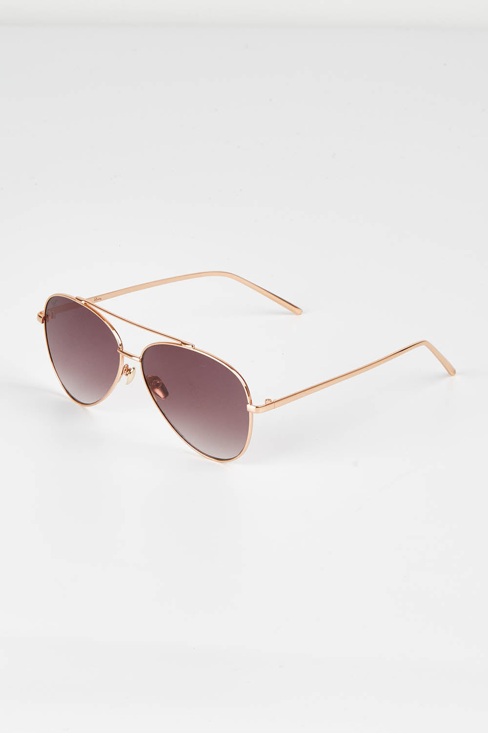 A model wearing size OneSize of the Mr Chips Sunglasses in colour RoseGold (Metallics), from the front, showing the whole outfit