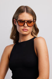 Product shot of the Runway Sunglasses - Turtle in colour Turtle, from the front
