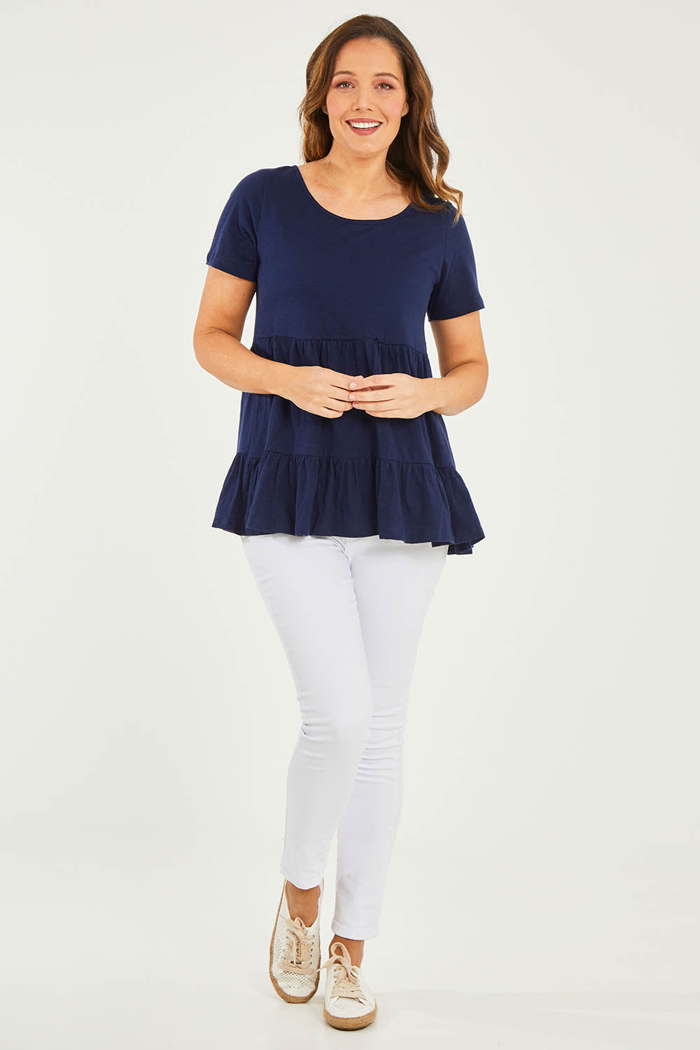 Model Georgia wearing size 10 of the Harper Layered Top in colour Navy (Blue), from the front, showing the whole outfit