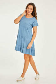 Model Georgia wearing size 10 of the Audrey Layered Dress in colour Denim (Blue), from the front, showing the whole outfit