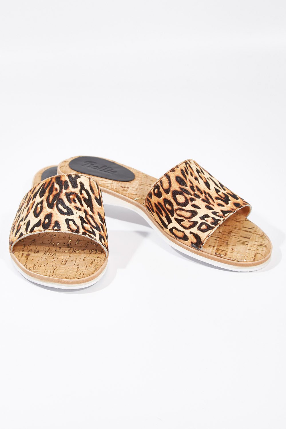 A model wearing size 38 of the Sandal Leopard Slide in colour Leopard, from the front, showing the whole outfit