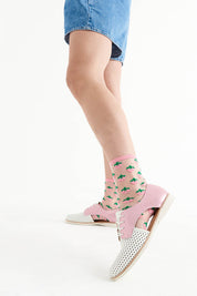 A model wearing the Sidecut Punch White Pink Shimmer in colour Whitepink (White), from the front, showing the whole outfit