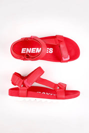 A model wearing size 37 of the Sandal Tooth Leather Wedge in colour Fiestared (Red), from the front, showing the whole outfit