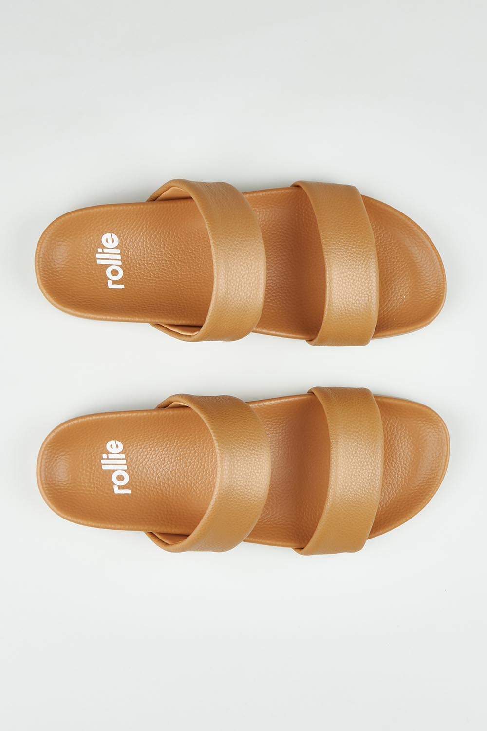 A model wearing size 37 of the Tide Leather Double Strap Slide in colour Softtan, from the front, showing the whole outfit