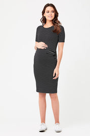 A model wearing the Mia Short Sleeve Nursing Maternity Dress in colour Blackflint (Black), from the front, showing the whole outfit