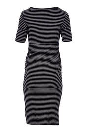 Product shot of the Mia Short Sleeve Nursing Maternity Dress in colour Blackflint (Black), from the back