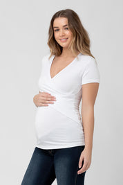 A model wearing the Embrace Tee in colour White (White), from the front, cropped image