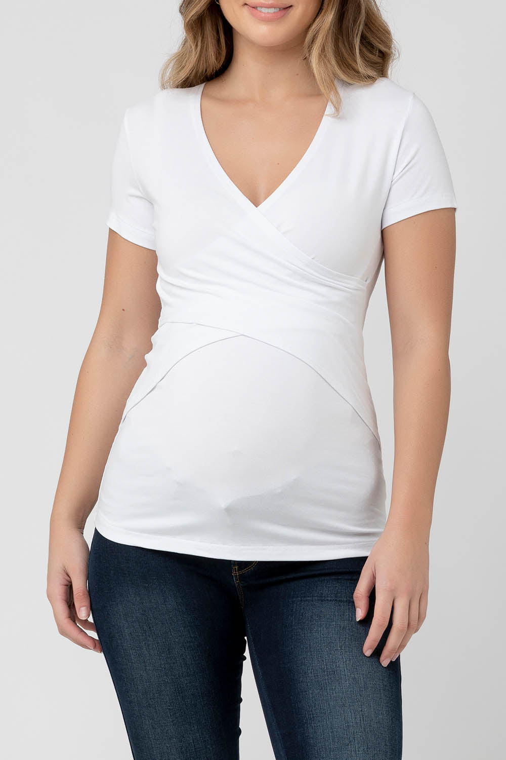 A model wearing the Embrace Tee in colour White (White), from the front, cropped image
