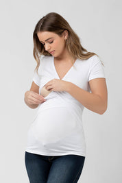 A model wearing the Embrace Tee in colour White (White), from the front, cropped image