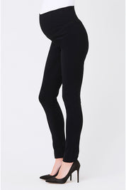 A model wearing the Suzie Maternity Super Straight Pant in colour Black (Black), from the front, cropped image