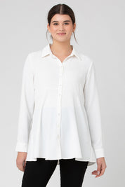 A model wearing the Tina Peplum Shirt in colour White (White), from the front, cropped image