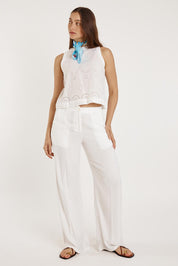 A model wearing the Agay Cotton Top in colour White (White), from the front, showing the whole outfit