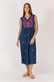 A model wearing the Andaman Cotton Midi Dress in colour Navy (Blue), from the front, showing the whole outfit