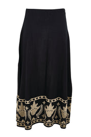 Product shot of the Arnun Skirt – Black in colour Black, from the back
