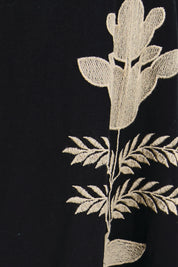 Product shot of the Arnun Skirt – Black in colour Black, showing detail