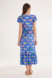 Model Madeline wearing size S of the Birds Of Surfers Wrap Dress in colour Blue (Blue), from the back