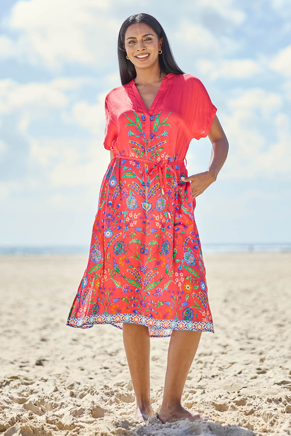 Model Eshan wearing size 10 of the Bodrum Dress - Red in colour Red, from the front