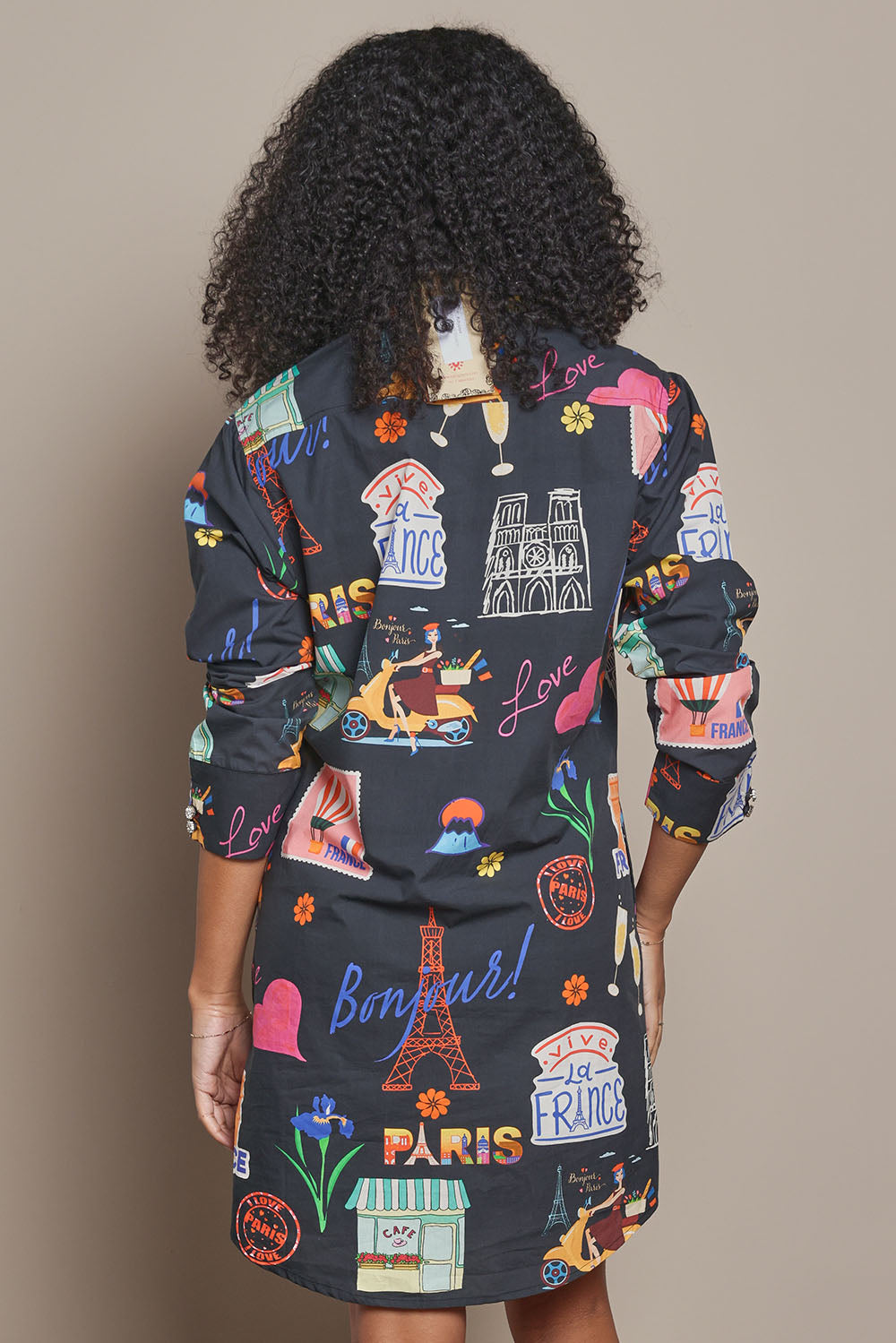 Model Ziara wearing size S of the Bonjour Cotton Shirtmaker Dress in colour Black (Black), from the back