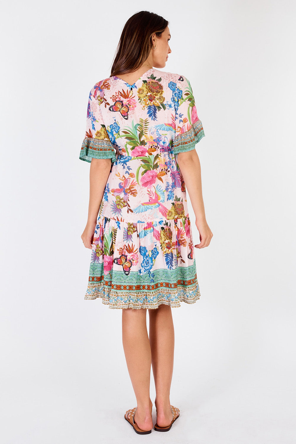 A model wearing the Caatinga Dress in colour Pink (Pink), from the back