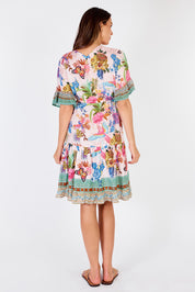 A model wearing the Caatinga Dress in colour Pink (Pink), from the back