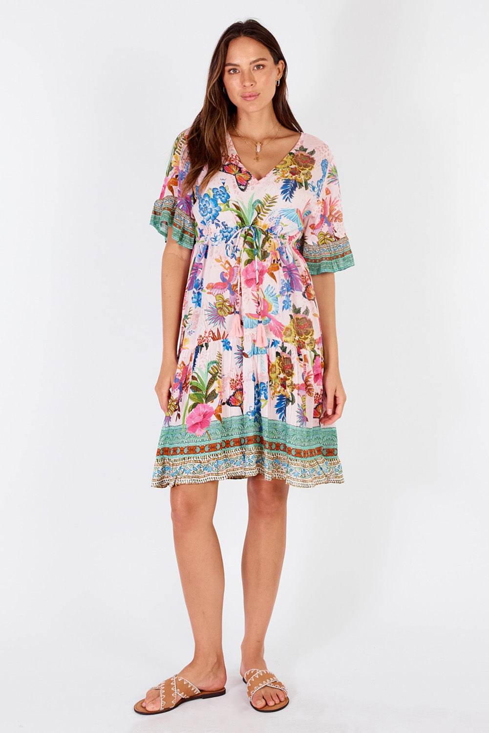 A model wearing the Caatinga Dress in colour Pink (Pink), from the front, showing the whole outfit