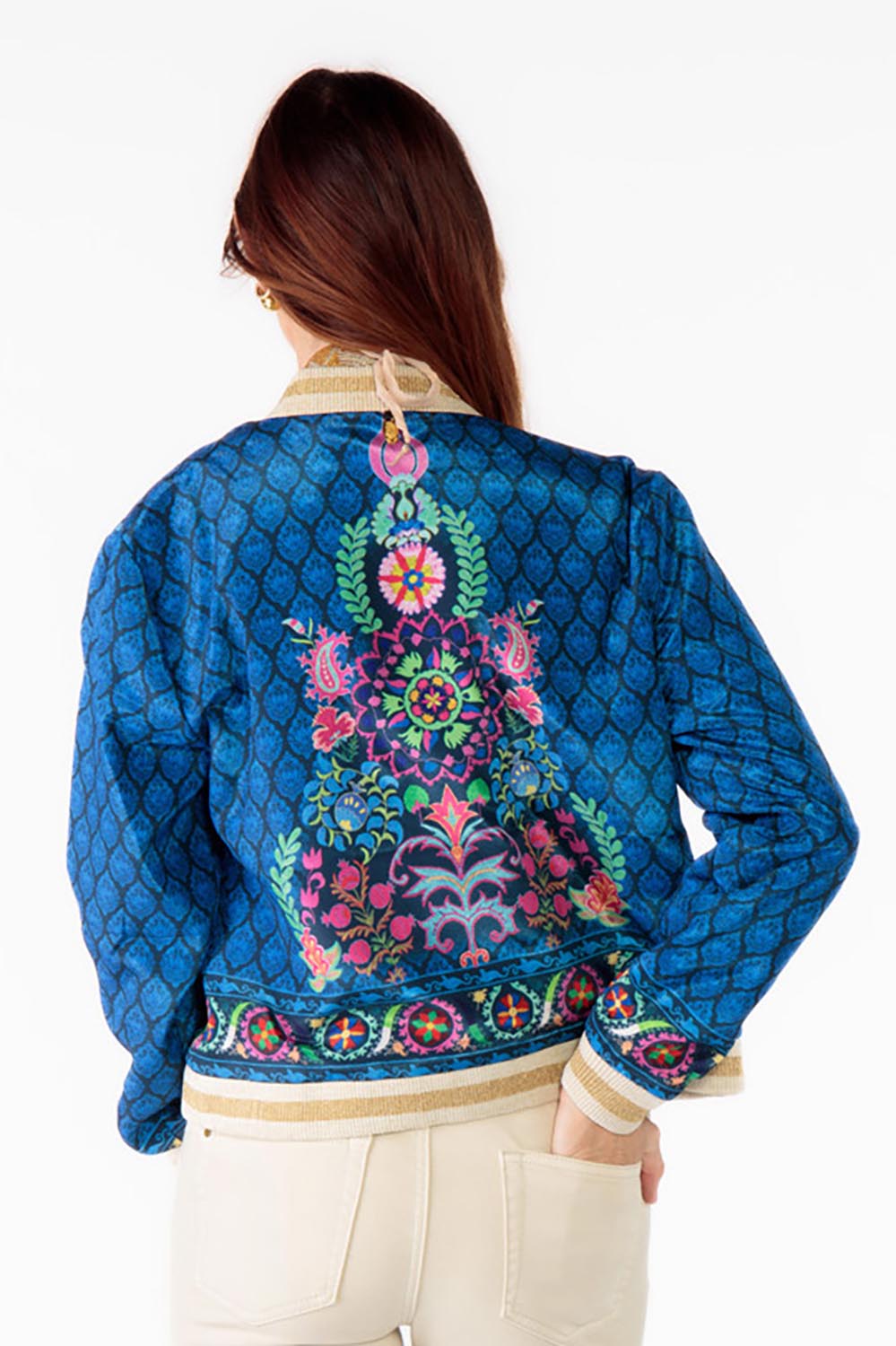 A model wearing the Camilla Jacket in colour Blue (Blue), from the back