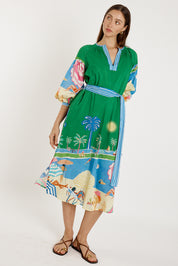 A model wearing the Cote D'azur Cotton Dress in colour Print (Green), from the front, showing the whole outfit