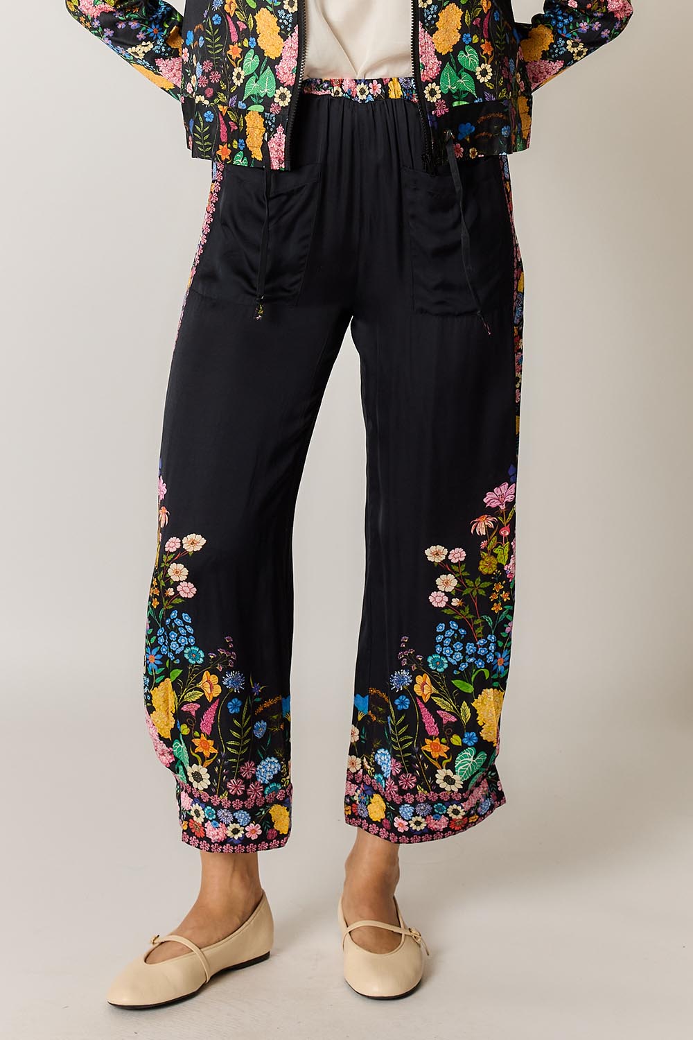 Model Genericm wearing size sample of the Delicia Pant – Black in colour Black, from the front