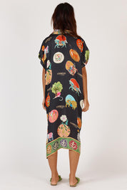 A model wearing the Down Under Kaftan in colour Black (Black), from the back