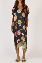 A model wearing the Down Under Kaftan in colour Black (Black), from the front, cropped image