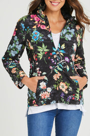 Model Madeline wearing size S of the Evergreen Puffer in colour Black (Black), from the front, cropped image