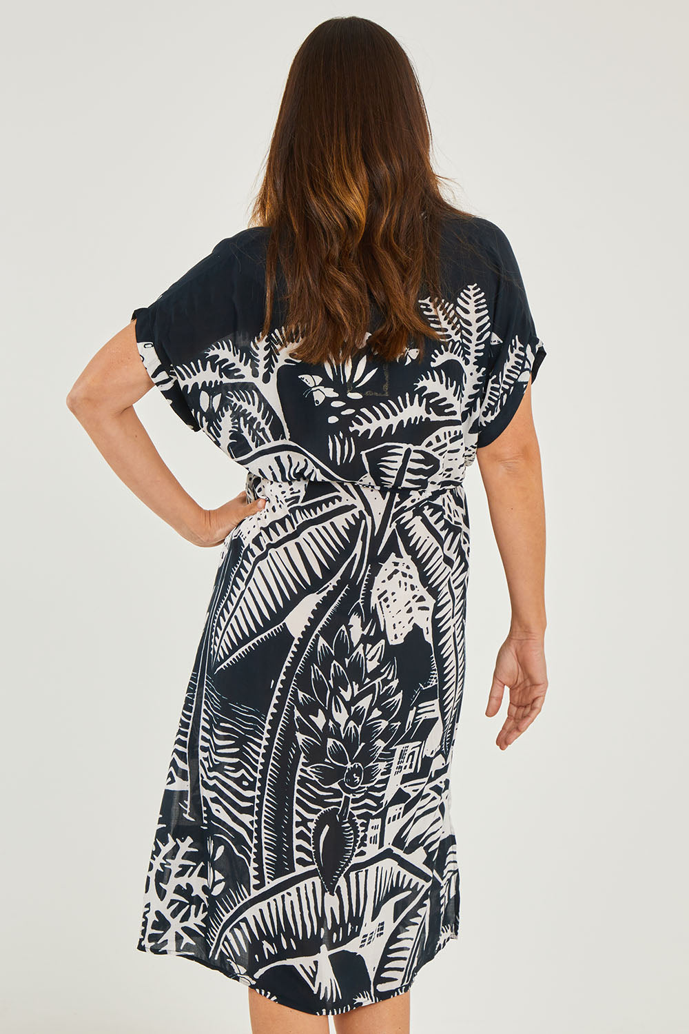 Model Georgia wearing size S of the Georgia Dress in colour Navy (Blue), from the back