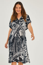 Model Georgia wearing size S of the Georgia Dress in colour Navy (Blue), from the front, cropped image