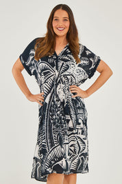 Model Georgia wearing size S of the Georgia Dress in colour Navy (Blue), from the front, cropped image