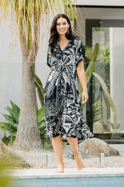 Model Stacey wearing size S of the Georgia Dress in colour Navy (Blue), from the front, showing the whole outfit