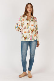 A model wearing the Gigi Shirt in colour Print, from the front, showing the whole outfit