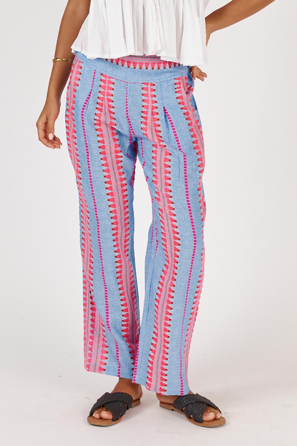 A model wearing the Ithaca Cotton Blend Pant in colour Neon, from the front, cropped image