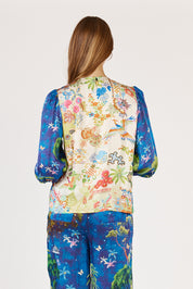 A model wearing the Mataram Bolero in colour Navy, from the back