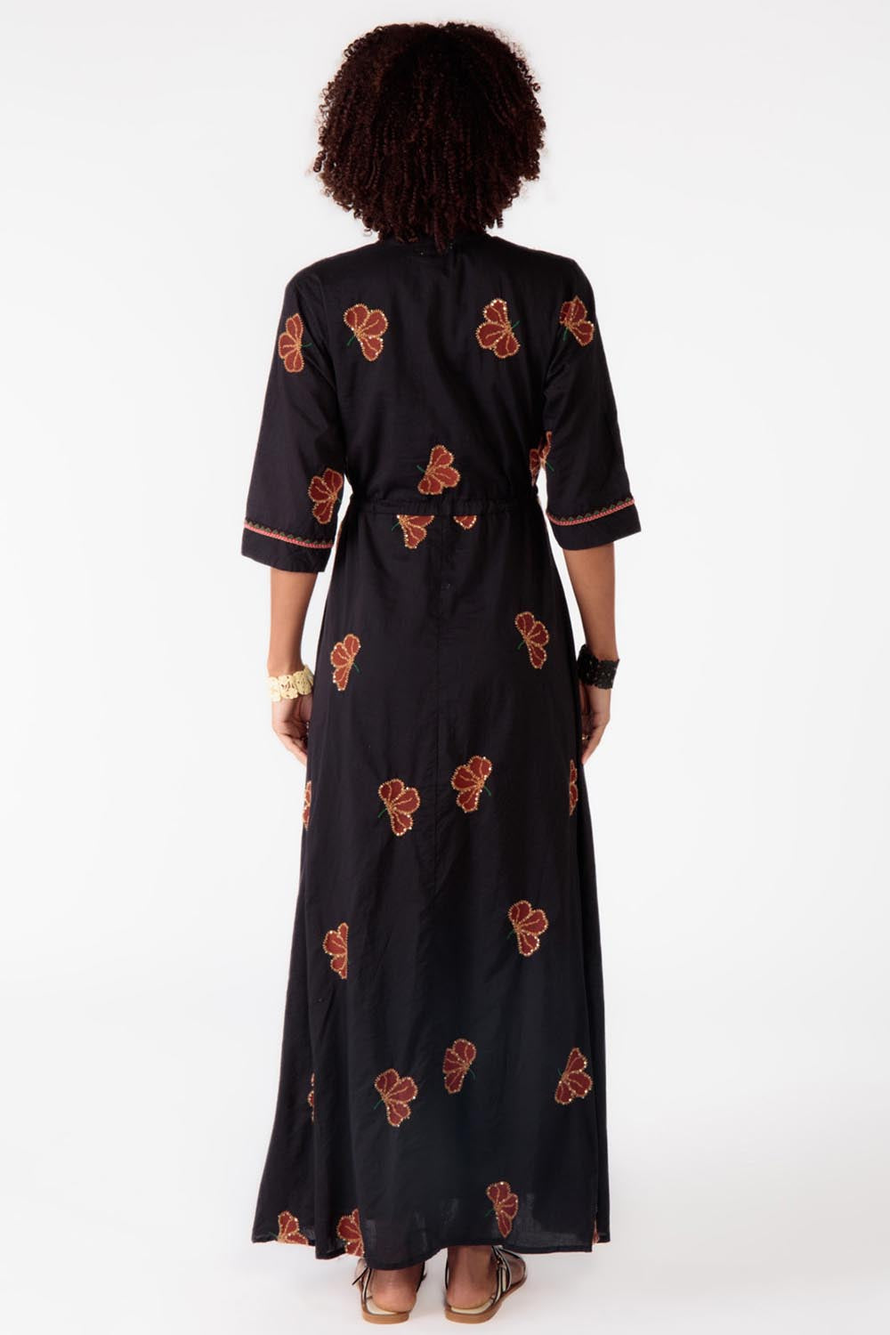 A model wearing the Miguel Cotton Dress in colour Black (Black), from the back