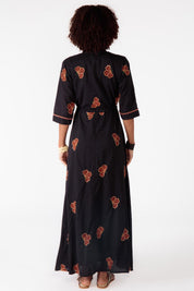 A model wearing the Miguel Cotton Dress in colour Black (Black), from the back