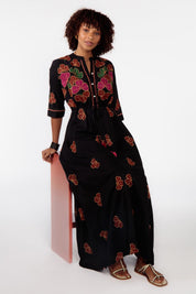 A model wearing the Miguel Cotton Dress in colour Black (Black), from the front, showing the whole outfit