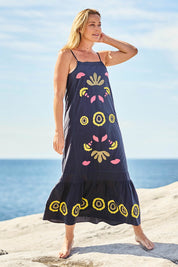 Model Bianca wearing size S of the Monoki Cotton Dress in colour Black (Black), from the front, showing the whole outfit