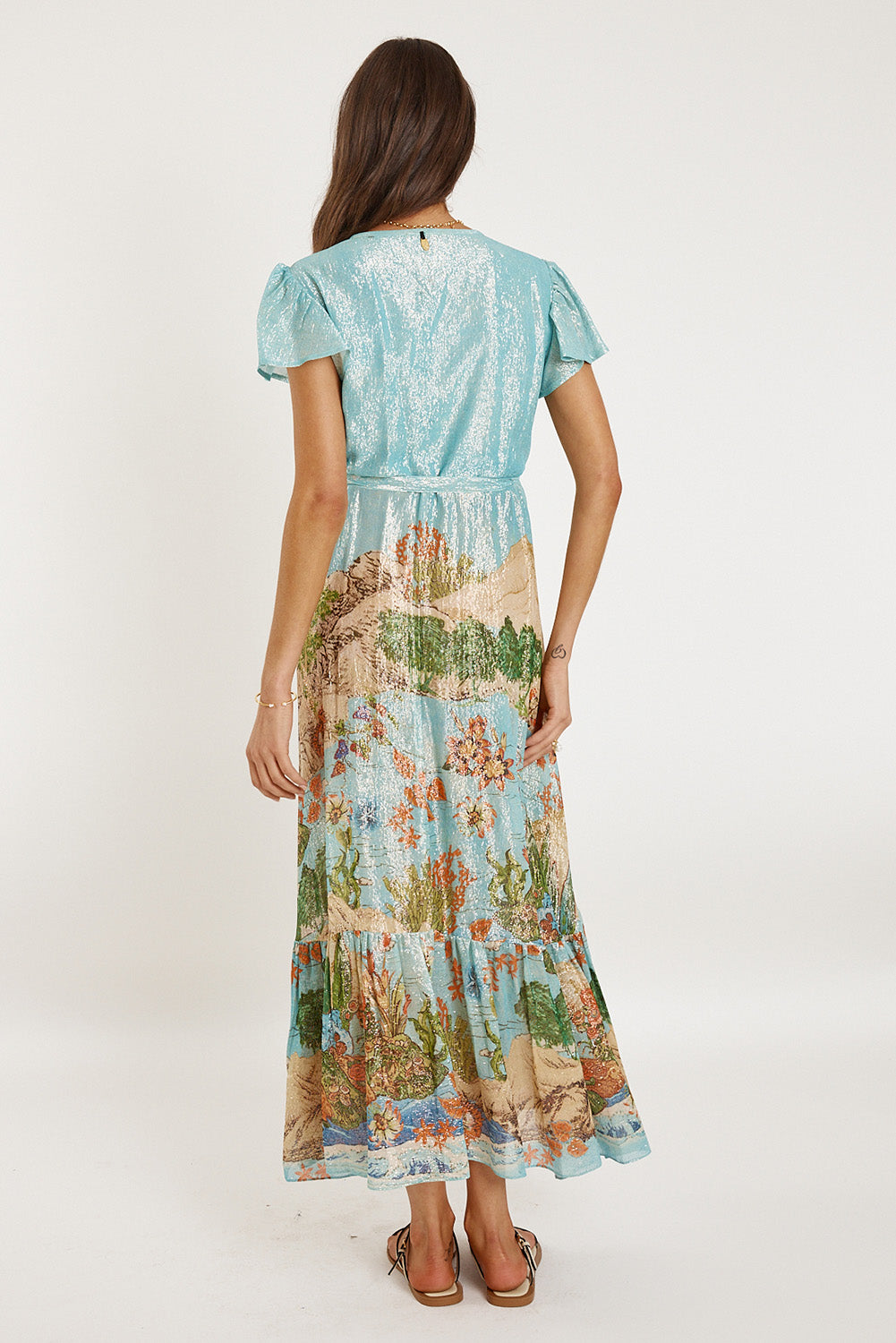 A model wearing the Montpellier Wrap Dress in colour Print (Blue), from the back