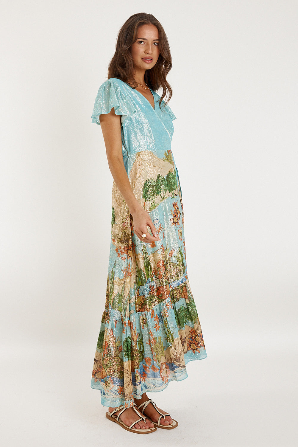 A model wearing the Montpellier Wrap Dress in colour Print (Blue), from the front, showing the whole outfit