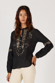 A model wearing the Moonshine Cotton Shirt in colour Black (Black), from the front, cropped image