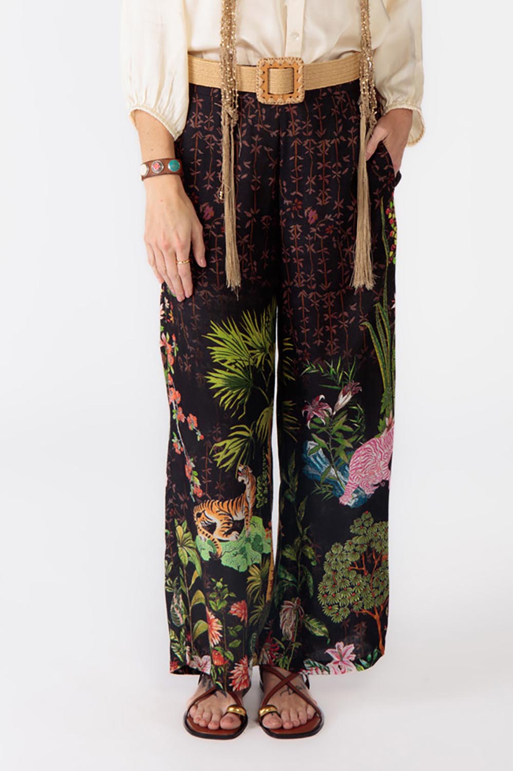 A model wearing the Nouveau Pant in colour Black (Black), from the front, cropped image