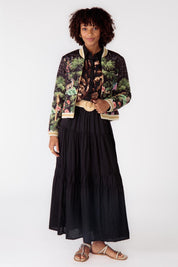 A model wearing the Nouveau Quilted Jacket in colour Black (Black), from the front, showing the whole outfit