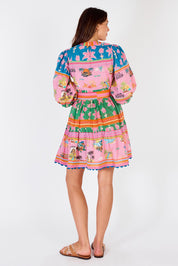A model wearing the Ohana Cotton Dress in colour Pink (Pink), from the back