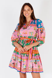 A model wearing the Ohana Cotton Dress in colour Pink (Pink), from the front, cropped image
